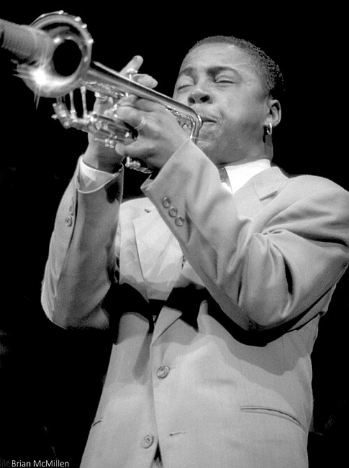 Black-and-white photograph of Roy Hargrove playing trumpet.